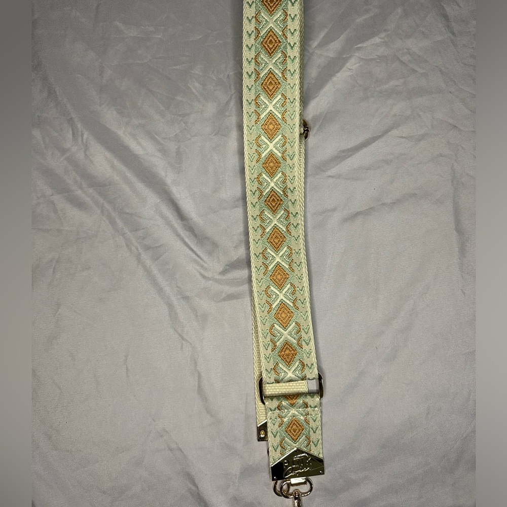 Super cute Victoria’s Secret pink purse tan and mint strap.